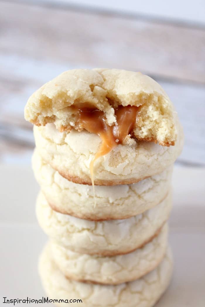 These Caramel Filled Sugar Cookies will melt in your mouth and blow your mind. The smooth caramel is the perfect surprise inside a soft, chewy cookie!