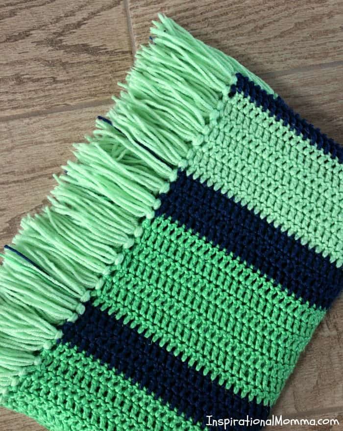 This Double Crochet Striped Blanket is a perfect project for any crocheter! Using only a double crochet stitch, it is so simple, anyone can do it! double crochet, crochet, #inspirationalmomma #homemade #diy #howtocrochet #crocheting #beginning #easy #simple
