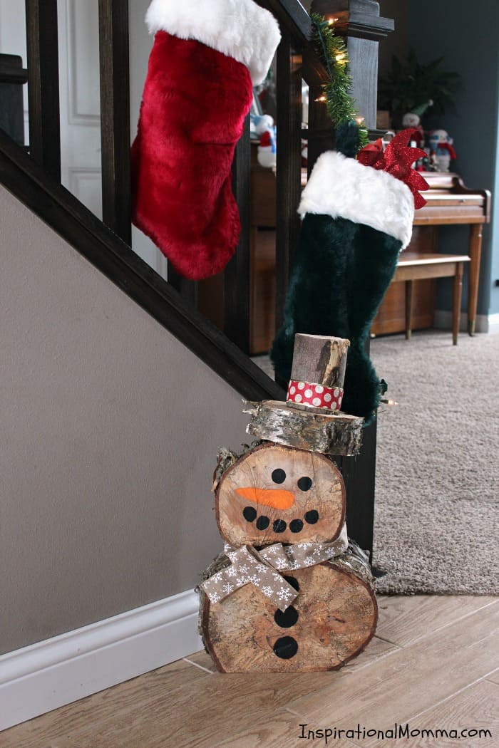 This DIY Log Snowman is so simple to make at a minimal cost. He is quite cute and is sure to create a festive winter wonderland!