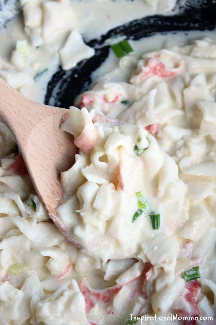 This Crab Alfredo Pasta is easy to make and even easier to enjoy! Sweet crab smothered in a creamy sauce served over a bed of pasta...absolutely delicious!