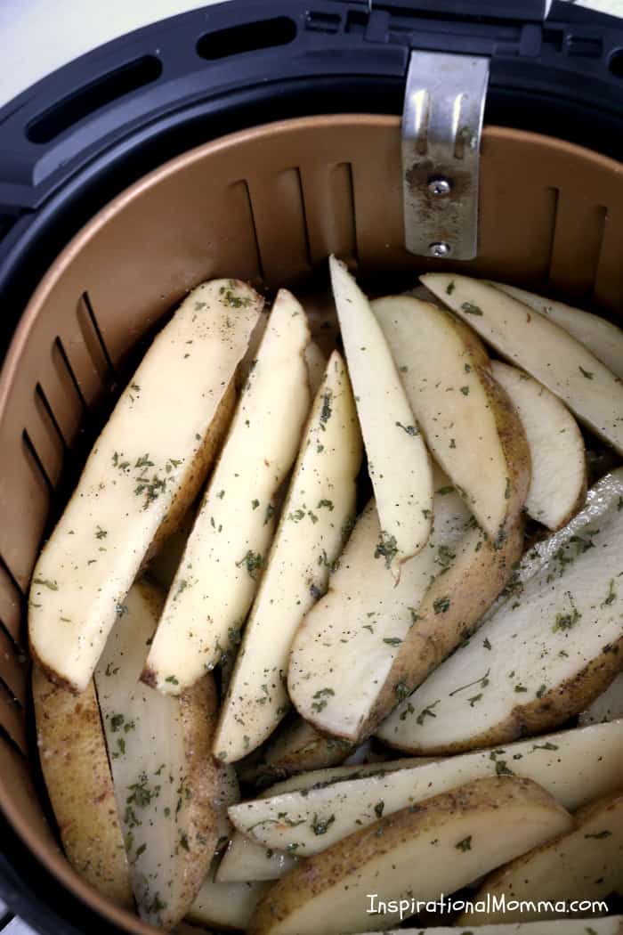 Air Fryer Potato Wedges are a perfect side dish to any meal. Simple to make and easy to enjoy, Air Fryer Potato Wedges will become a family favorite! #InspirationalMomma #airfryerpotatowedges #airfryer #potatowedges #sidedish #potatoes #recipe #recipes #appetizers #appetizer
