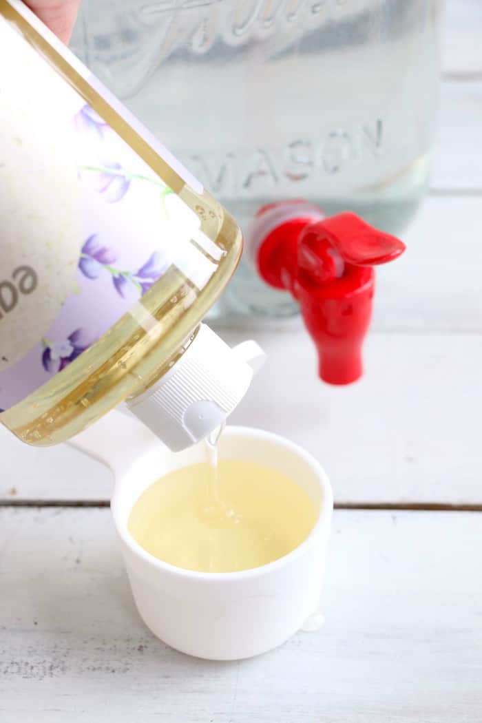 This Homemade Liquid Laundry Detergent will leave your clothes clean and smelling fresh while saving you money. Made with just 5 ingredients, it is so easy! #inspirationalmomma #homemadeliquidlaundrydetergent #laundrydetergent #homemade #diy #cleaning #cleaner #laundry #momonabudget