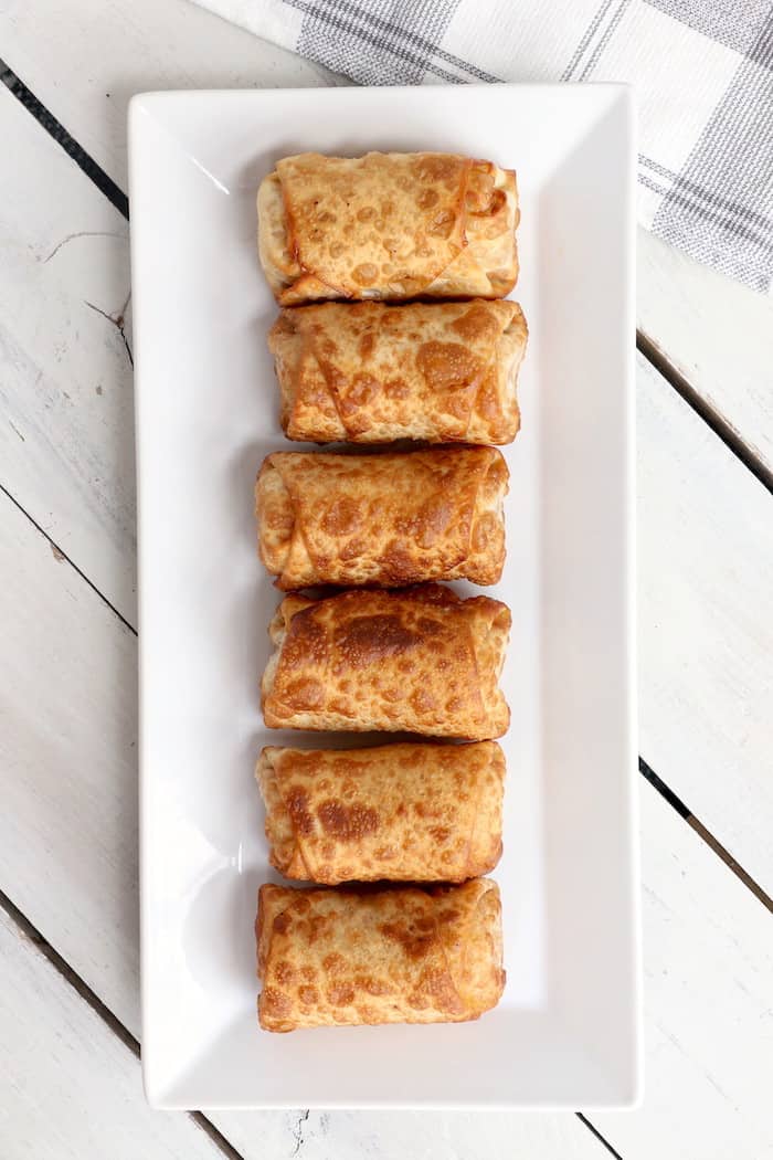 This Peanut Butter Banana Egg Roll Recipe is amazing! A crispy egg roll wrapper filled with creamy peanut butter and a sweet banana makes a perfect dessert! #InspirationalMomma #EggRollRecipe #PeanutButter #Banana #PeanutButterBanana #EggRolls #Recipe #Dessert #Desserts
