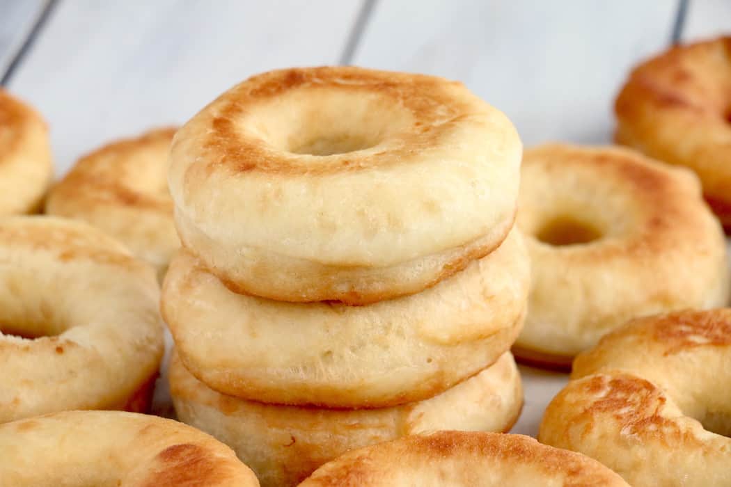 This Homemade Potato Donut Recipe makes soft, fluffy delicious donuts. Glazed with sweet icing, they are irresistible and absolutely addictive! #inspirationalmomma #homemadepotatodonutrecipe #donutrecipe #homemadedonuts #doughnuts #icing #homemadedoughnuts #homemade #deepfried