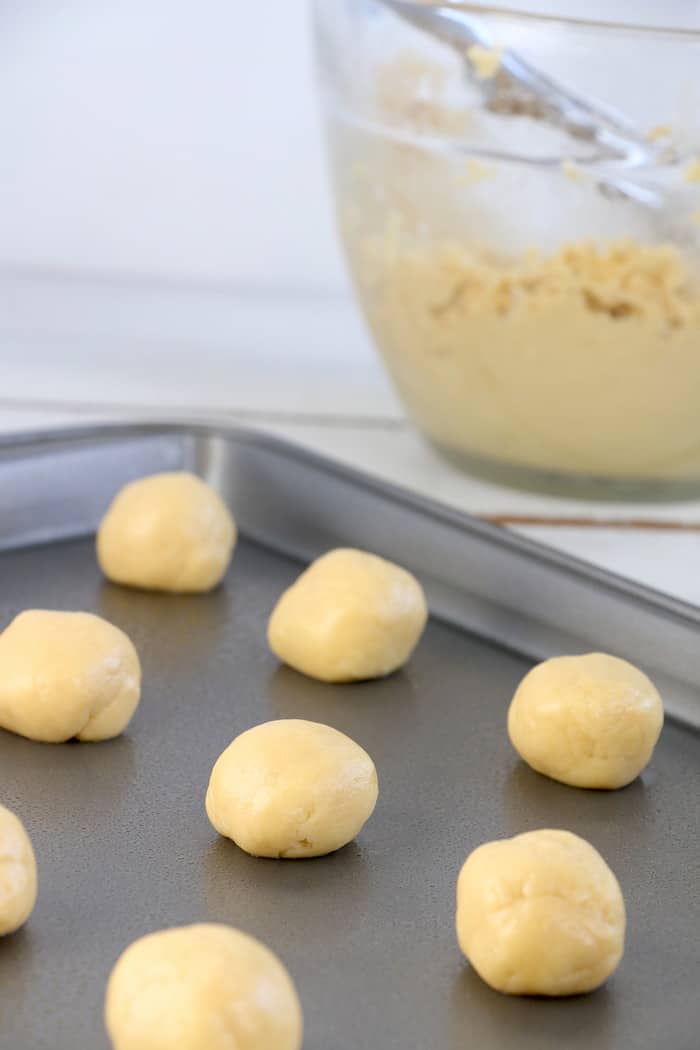 Soft Chewy Confetti Cookies are light, delicious and melt in your mouth. Covered with sweet icing and sprinkles, they are absolutely irresistible! #inspirationalmomma #confetticookies #cookies #softandchewy #recipe #dessert #desserts #cookie