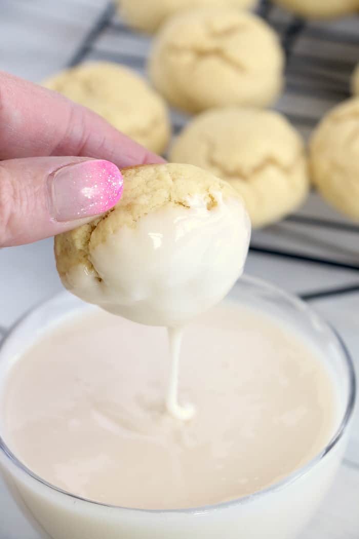 Soft Chewy Confetti Cookies are light, delicious and melt in your mouth. Covered with sweet icing and sprinkles, they are absolutely irresistible! #inspirationalmomma #confetticookies #cookies #softandchewy #recipe #dessert #desserts #cookie