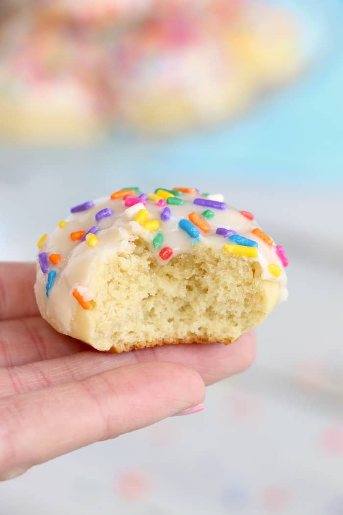 Soft Chewy Confetti Cookies are light, delicious and melt in your mouth. Covered with sweet icing and sprinkles, they are absolutely irresistible! #inspirationalmomma #confetticookies #cookies #softandchewy #recipe #dessert #desserts #cookie