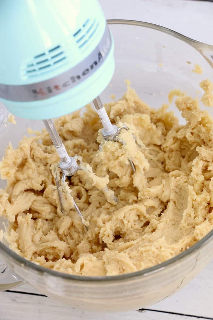 Soft Chewy Confetti Cookies are light, delicious and melt in your mouth. Covered with sweet icing and sprinkles, they are absolutely irresistible! #inspirationalmomma #confetticookies #cookies #softandchewy #recipe #dessert #desserts #cookie
