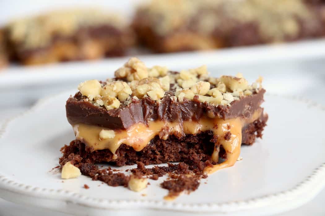 These Layered Caramel Brownies have it all. A chewy brownie crust and a gooey caramel middle, all finished off with a milk chocolatey top! #inspirationalmomma #caramelbrownies #layered #dessert #desserts #recipe #caramel #chocolate #brownies
