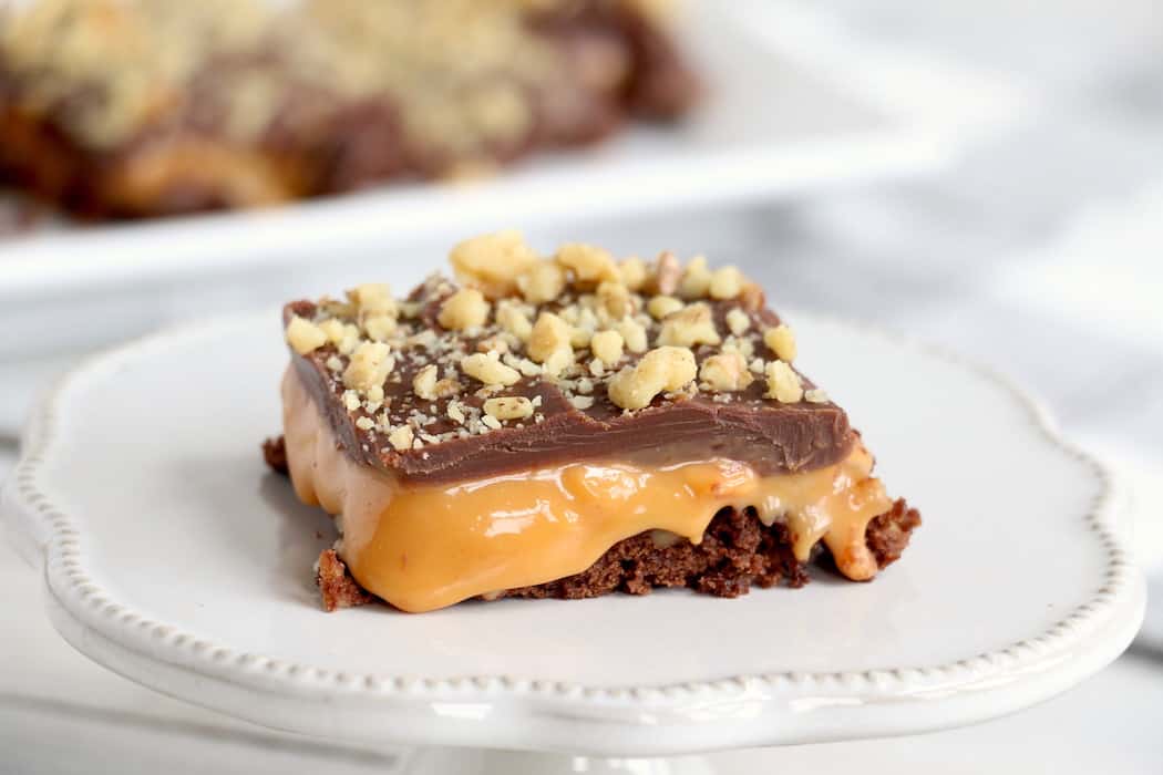 These Layered Caramel Brownies have it all. A chewy brownie crust and a gooey caramel middle, all finished off with a milk chocolatey top! #inspirationalmomma #caramelbrownies #layered #dessert #desserts #recipe #caramel #chocolate #brownies