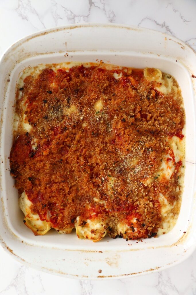 Overhead shot of cooked copycat Olive Garden stuffed shells in baking dish