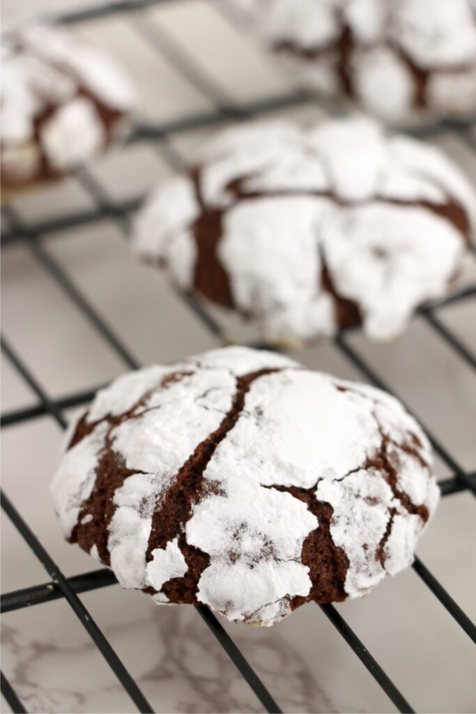 Closeup shot of chocolate crack cookies on cooling rack