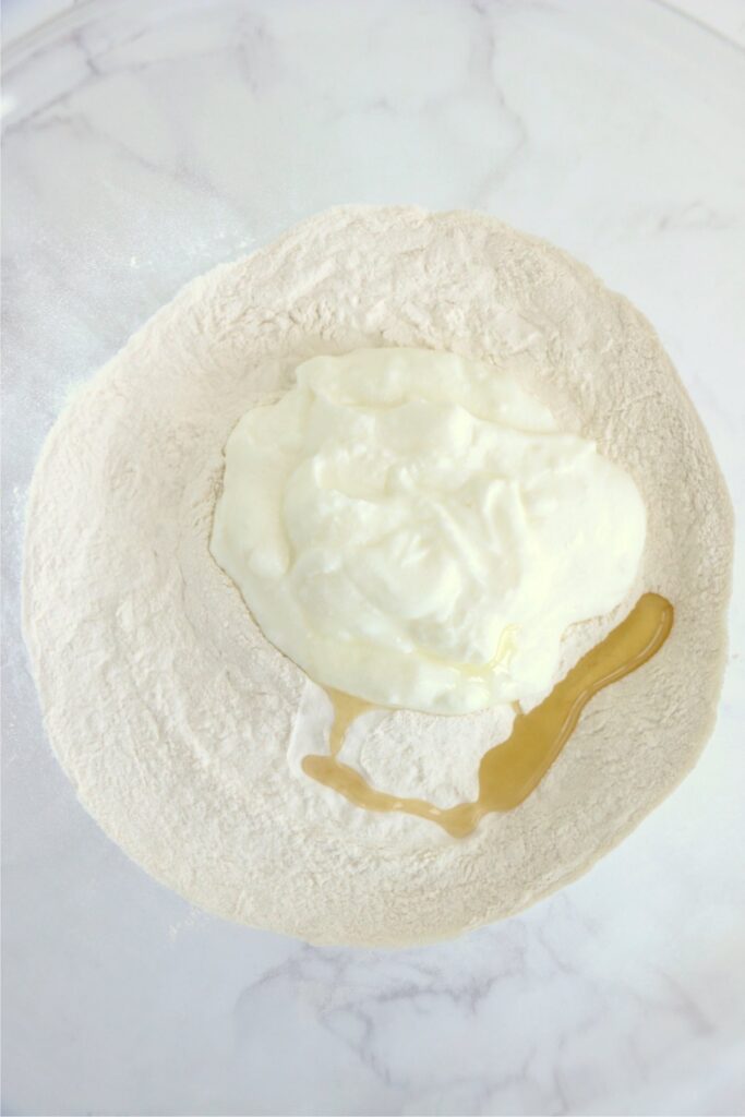 Overhead shot of air fryer flatbread ingredients in bowl