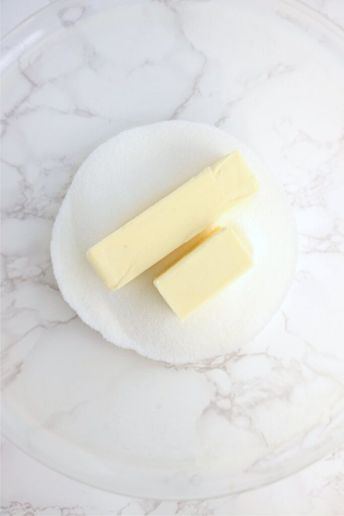 Overhead shot of butter and sugar in bowl