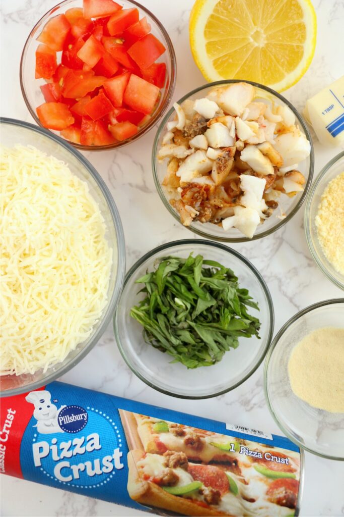 Overhead shot of pizza ingredients on table.