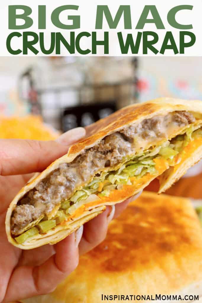 Closeup shot of hand holding half a Big Mac crunch wrap. 