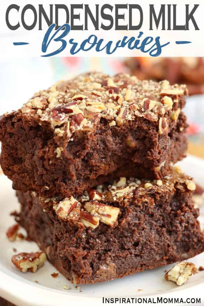 Closeup shot of two condensed milk brownies stacked atop one another. 